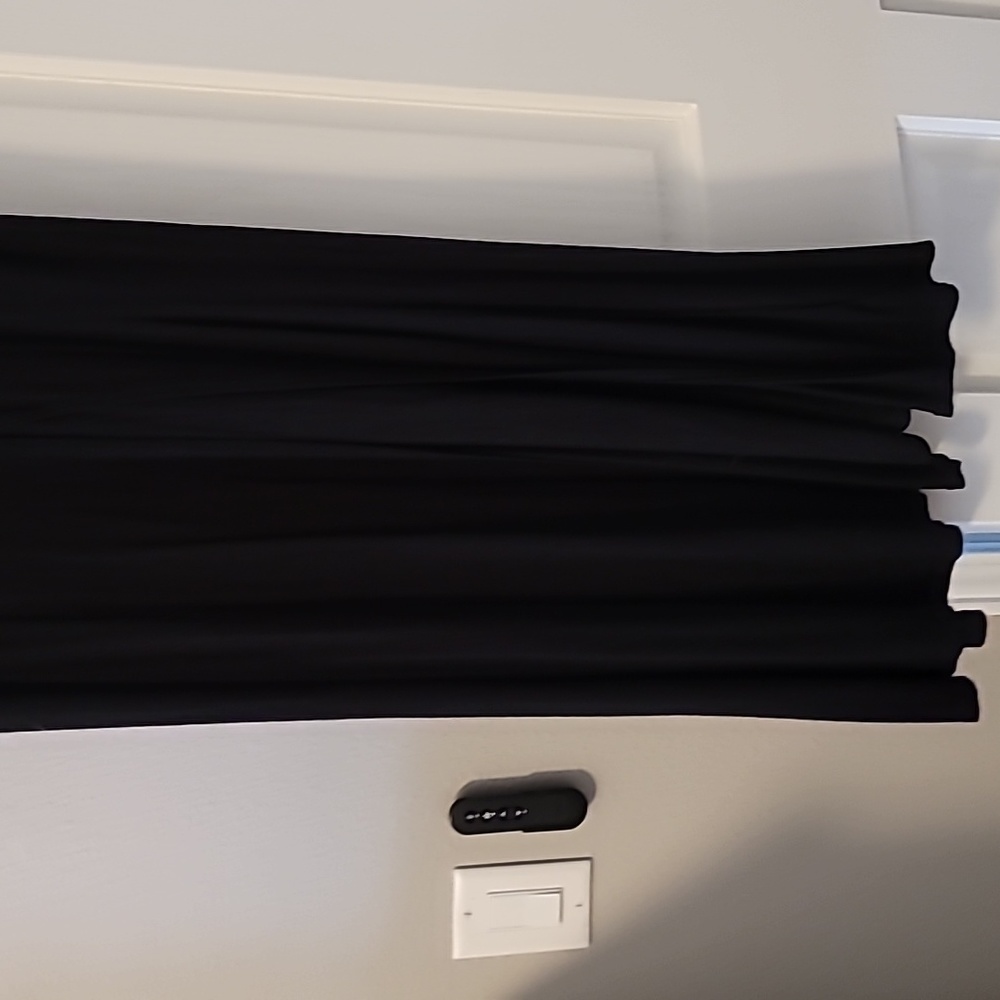 Long black shirt to the bottom of my ankles, front opening down the leg.